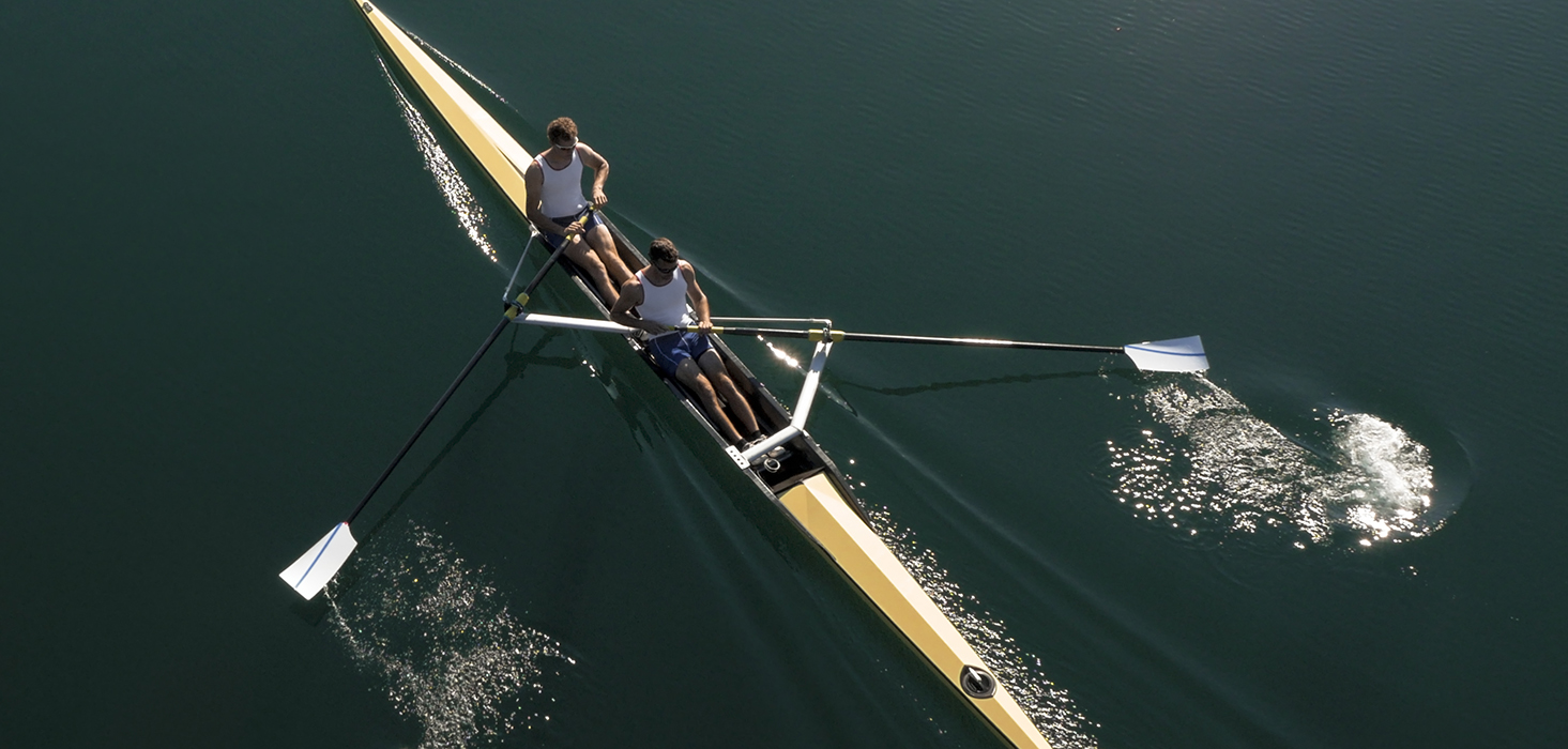 Athletes sculling Sweeps Rowing Boat